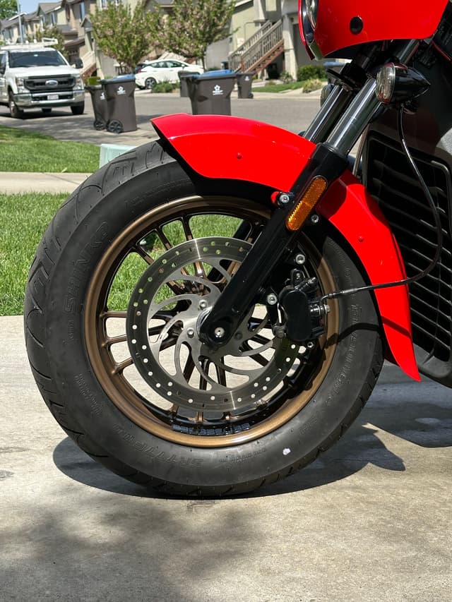 Close-up of the left side of the motorcycle wheels.