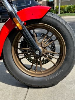 Close-up of the right side of the motorcycle wheels zoomed in even further.